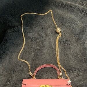 Elegant Pink Handbag with Gold Chain